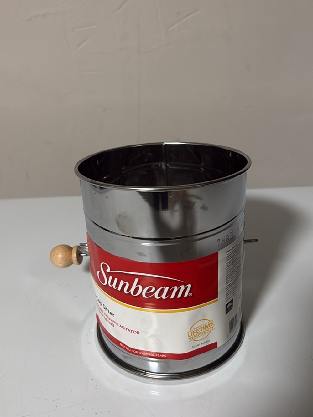 Sunbeam Stainless Steel Flour Sifter with Red & White Label and Wooden Handle